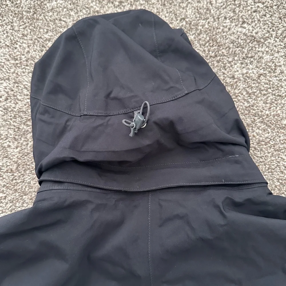 The North Face Black Hooded Raincoat with Multiple Front Pockets